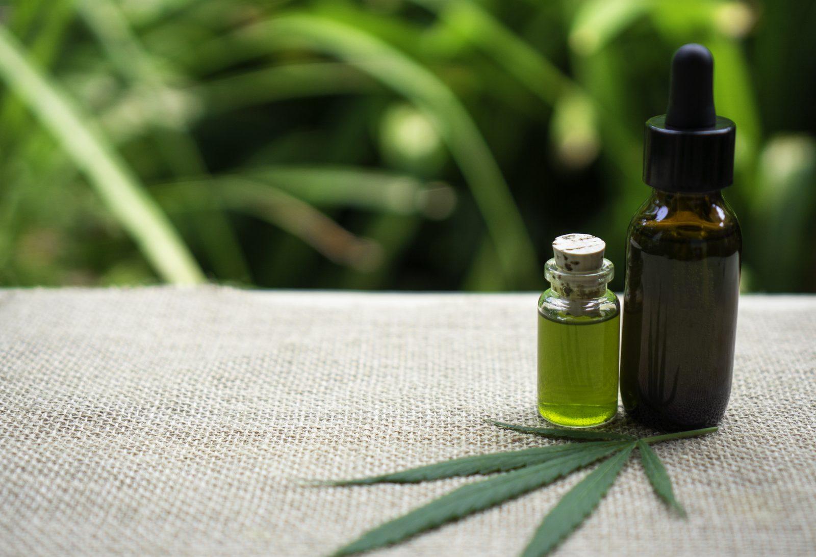 Cannabis oil and plant medicine on burlap